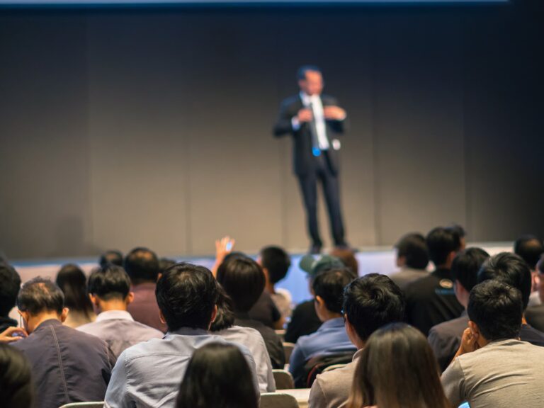rear-side-of-audiences-sitting-and-listening-the-s-2026-01-05-22-52-14-utc-cropped